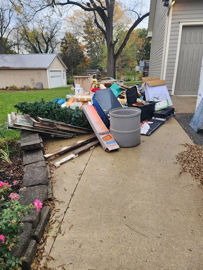 Dumpster being loaded with debris for Estate Cleanout Dumpster Rental in Crestwood